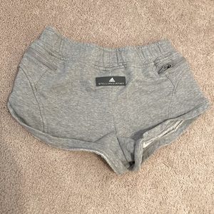 Barely worn adidas shorts, size small, grey, zipper pockets